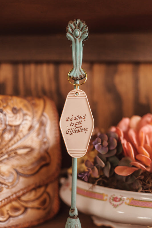 “It’s about to get western” keychain
